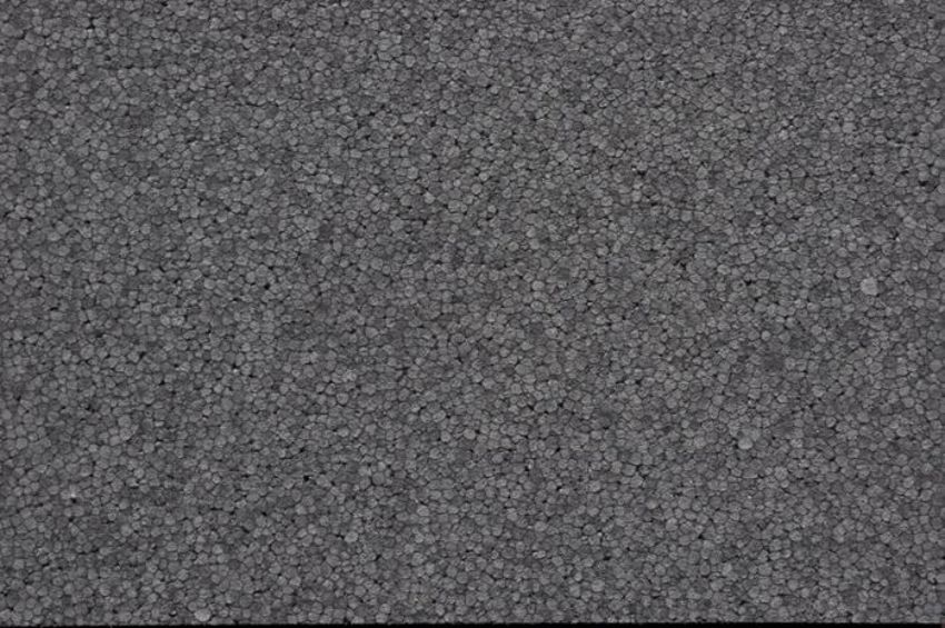 Close-up van grijs geëxpandeerd polystyreen in een isolatieplaat gevormd. 